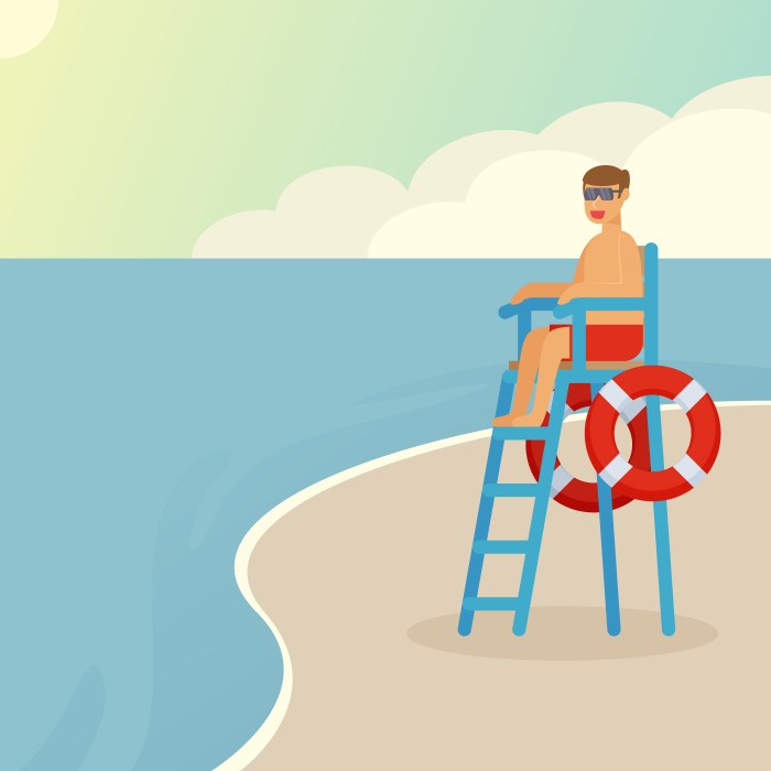 A lifeguard is sitting on a platform